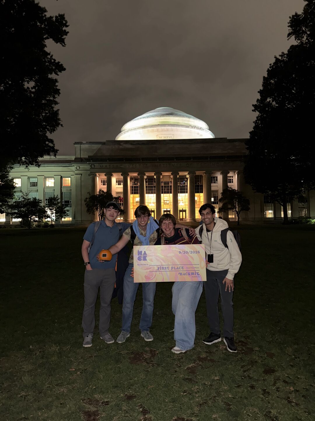 The Peel team with their first-place award in front of MIT’s Great Dome