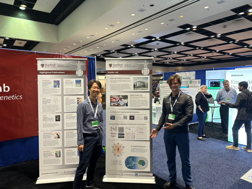 Viktor Minchev next to the StudySync poster at PMWC 2026